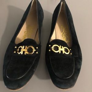 Suede black pair of Ferragamo loafers buckles